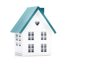 Model of a house on a white background. The concept of buying real estate, insurance, rent