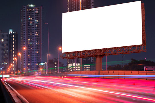 blank billboard on light trails, street and urban in the night - can advertisement for display or montage product or business