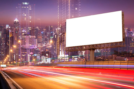 double exposure of white blank billboard on light trails street in the twilight or night city - can advertisement for display or montage product or business