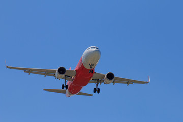 Passenger Airplane Taking Off Into The Blue Sky