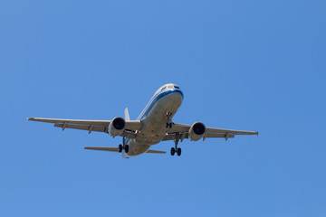 Passenger Airplane Taking Off Into The Blue Sky