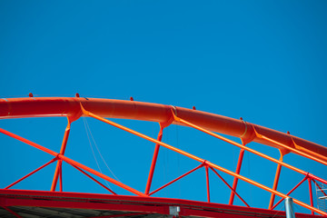 Roof steel construction of a stadium against blue sky