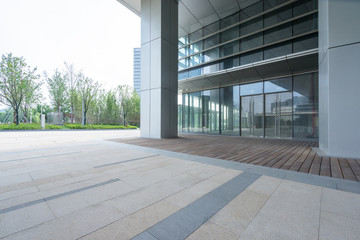 modern glass building exterior with empty pavement,copy space,shanghai,china.