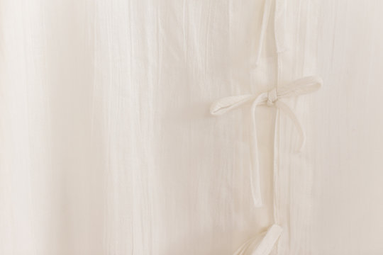 North Thai style traditional white calico clothes close up shirt tied clasper texture pattern for background