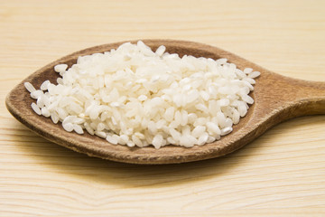 wooden spoon with rice