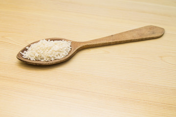 wooden spoon with rice