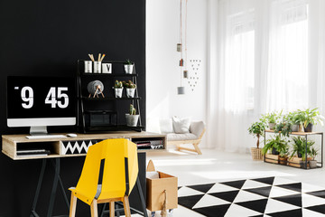 Workspace with yellow chair