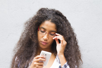 afro girl using her mobile phone