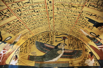 Fototapeta na wymiar Wall painting and decoration of the tomb: ancient Egyptian gods and hieroglyphs in wall painting 