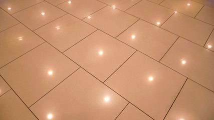 Glossy Tiled Floor with Lighting Reflection