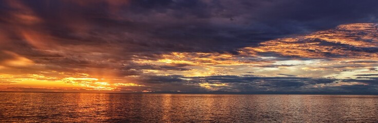 Panorama of the sunset by the sea