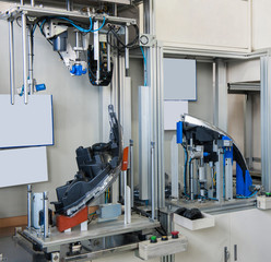 testing automobile headlights for leaks. factory equipment of quality control of car headlamps