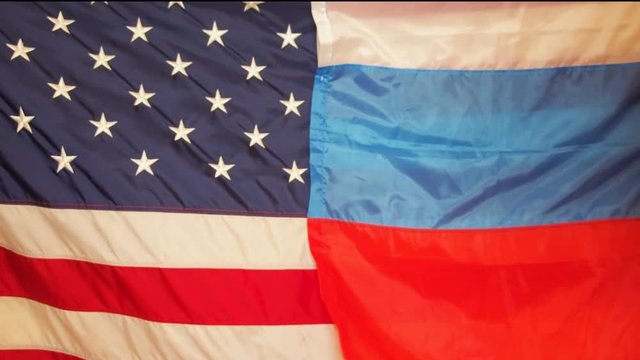 The American flag and the Russian flag. Flags of the USA and Russia together .