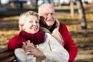 Mature couple sitting in park