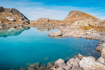 Beautiful blue mountain lake and stones. High in the mountains