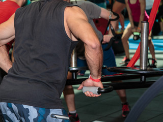 Boy in Class at Gym doing Cross-fit Exercises