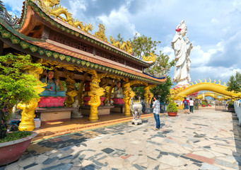 Dong Nai, Vietnam - October 8th, 2017: Buddhists Praying the buddha in the ancient architectural pagoda with beautiful statues depicting religious spiritual culture in Dong Nai, Vietnam.