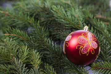 Christmas decorations on spruce branches.