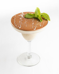 Tiramisu dessert in a glass on white background