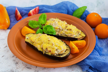 Stuffed eggplant with chicken and vegetables on white background