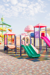 A Playground with slides in the summer