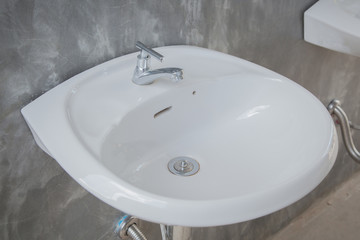 Bathroom interior with white sink and faucet