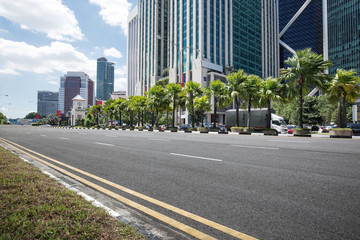 empty asphalt road with modern buildings