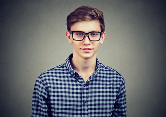 Portrait of a cool young guy in a checked shirt