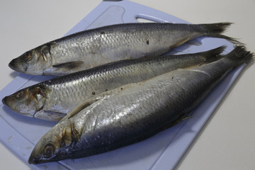 Salted Herring on a cutting Board