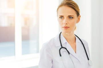 Female medical professional in labcoat looking into vacancy