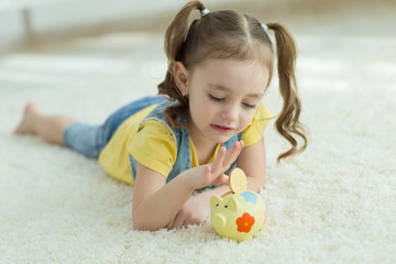 Child with a piggy bank 