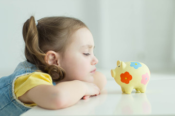 Child with a piggy bank 