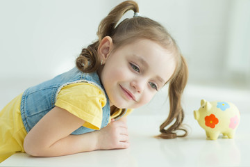 Child with a piggy bank 