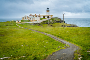 Fototapeta na wymiar Scenic sight of Neist Point Lighthouse and cliffs in the Isle of Skye, Scotland.