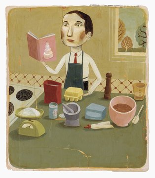 Man with cookbook baking in kitchen