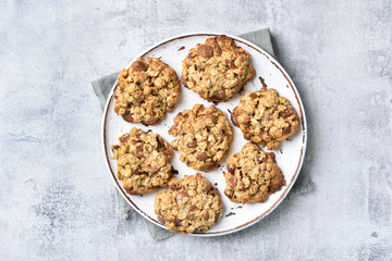Oats cookies on plate, top view