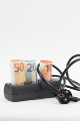 Euro bill, power strip and electricity cost