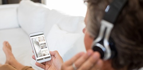 Composite image of interior of house on cellphone display