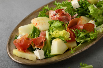 Melon salad with prosciutto slice