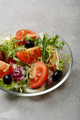tomato salad on glass plate on loft table