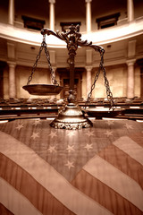 Decorative Scales of Justice in the Courtroom and flag of the United States