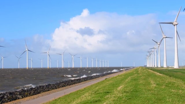 Wind turbines in an October fall storm at the IJsselmeer