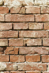 Wall of old, red baked brick; Architectural background, texture, pattern; Copy space, sign board.