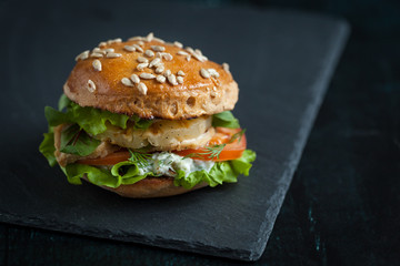 Burger with chicken, grilled pineapple and garlic sauce