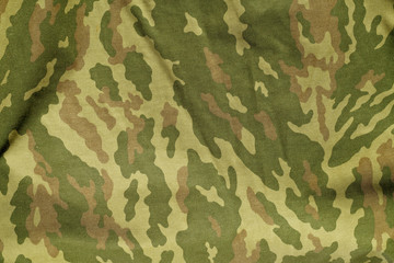 Fototapeta premium Green and brown military camouflage uniform pattern.