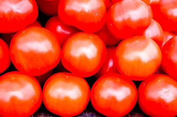 A lot of fresh red tomato together