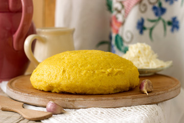 Mamaliaga or polenta, a traditional dish of Moldovan, Romanian, Hungarian and Ukrainian cuisine. Porridge from corn flour. Served with brynza, sour cream and garlic sauce.