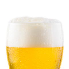 Water drops on glass of cold fresh light beer. Close-up