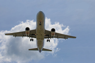 Passenger Airplane Taking Off Into The Blue Sky