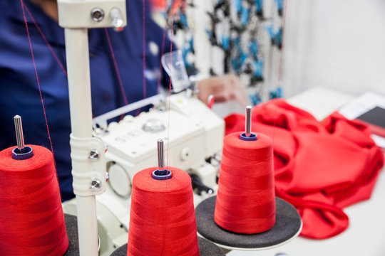 Seamstress working on overlocker in factory, Cape Town, South Africa